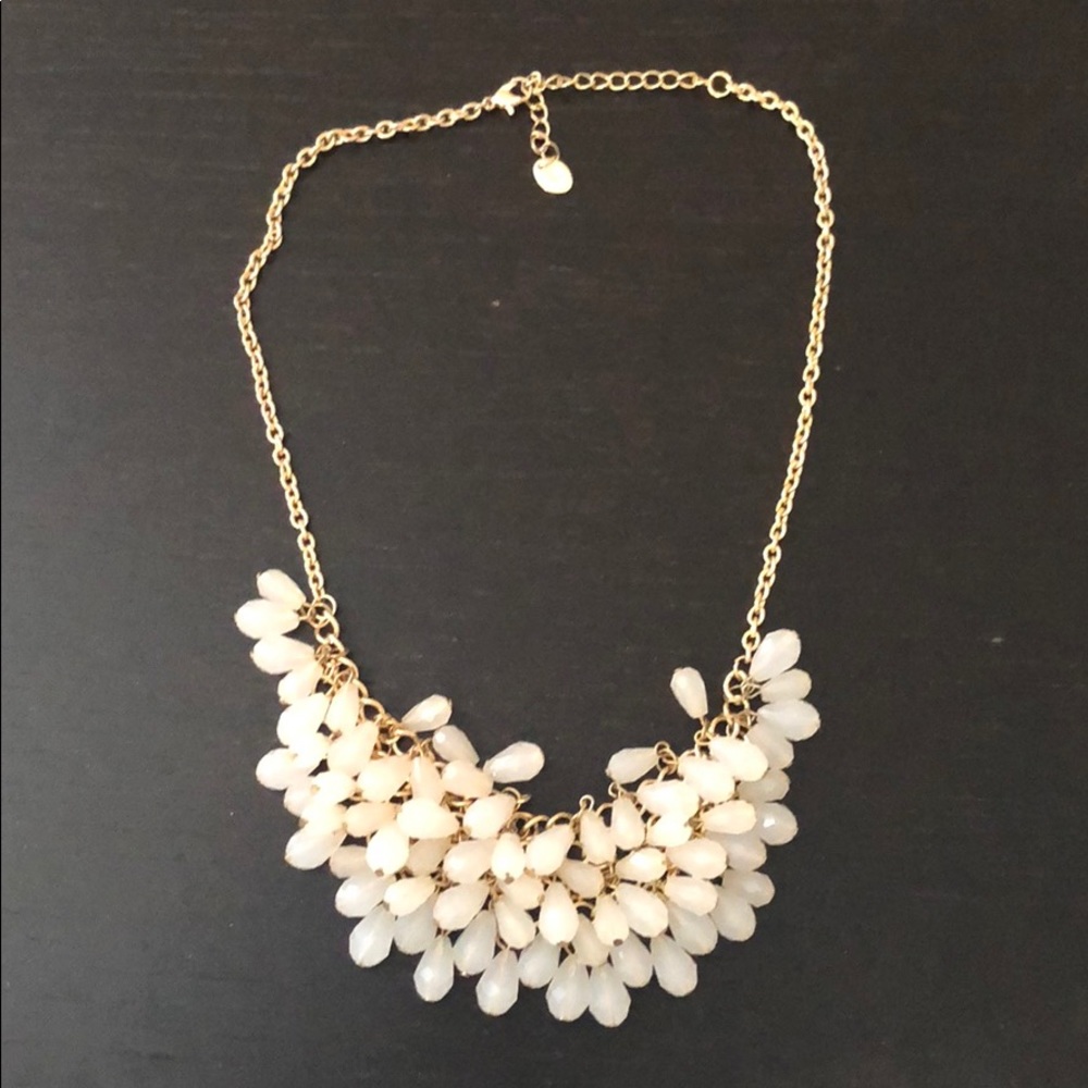 Gold necklace with off-white dangling beads